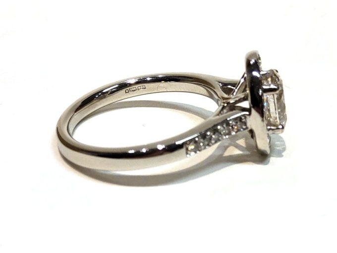 Oval Diamond Halo Platinum Solitaire Ring