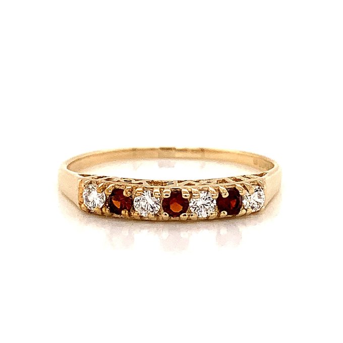C.Z. and Garnet Seven Stone Ring